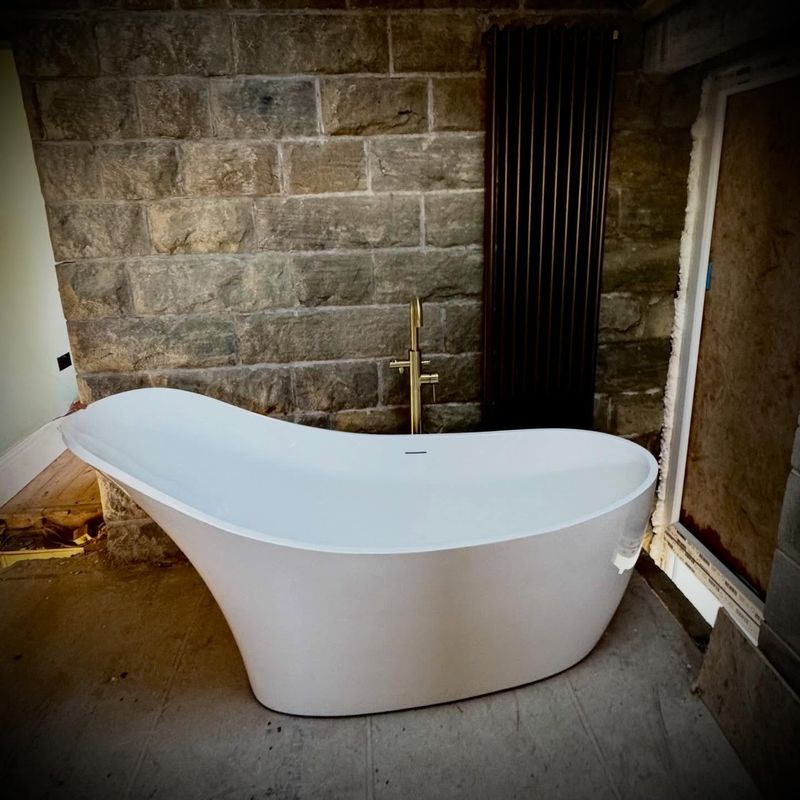 Freestanding bath in the restored bathroom