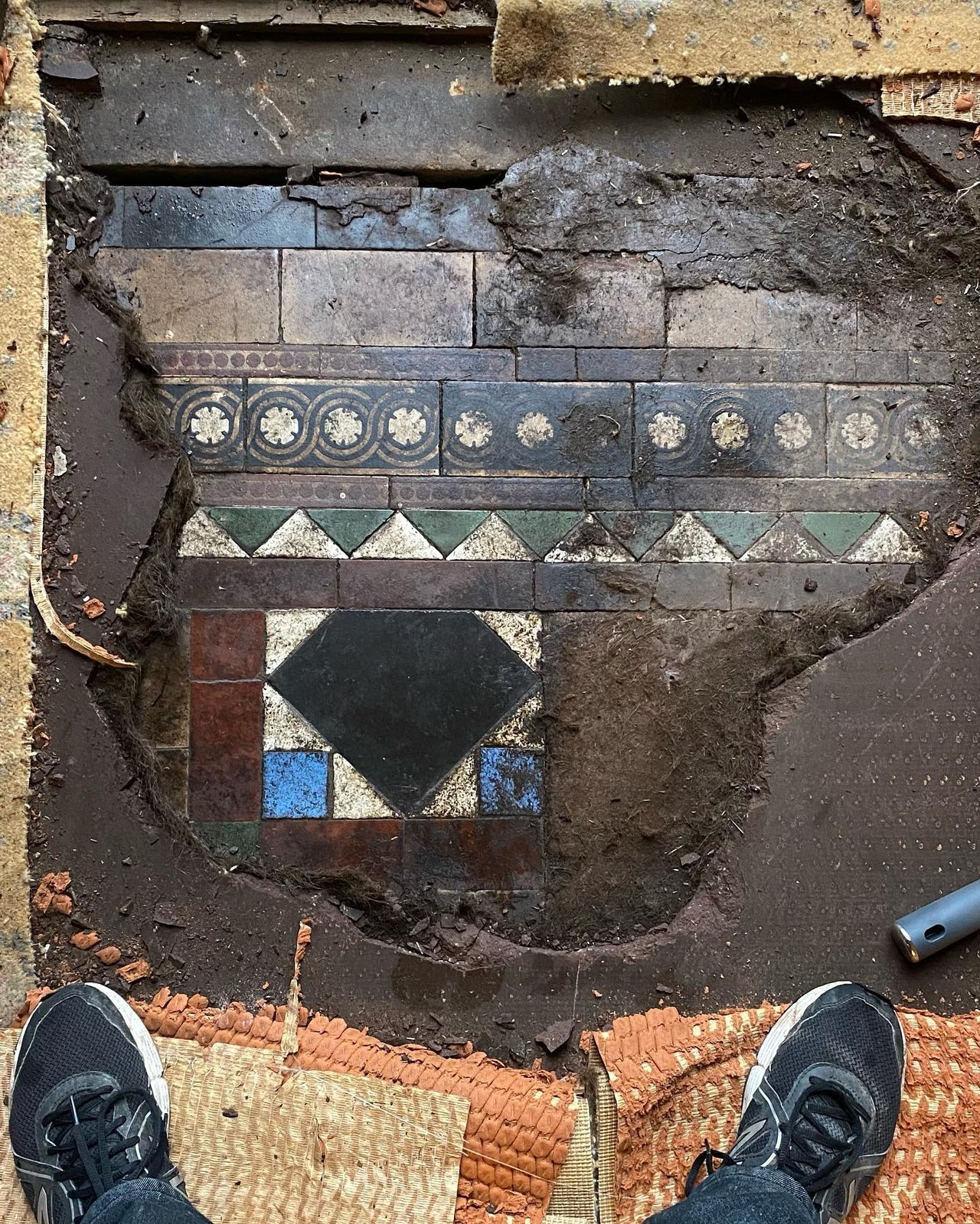 The original encaustic tiles found at the back door