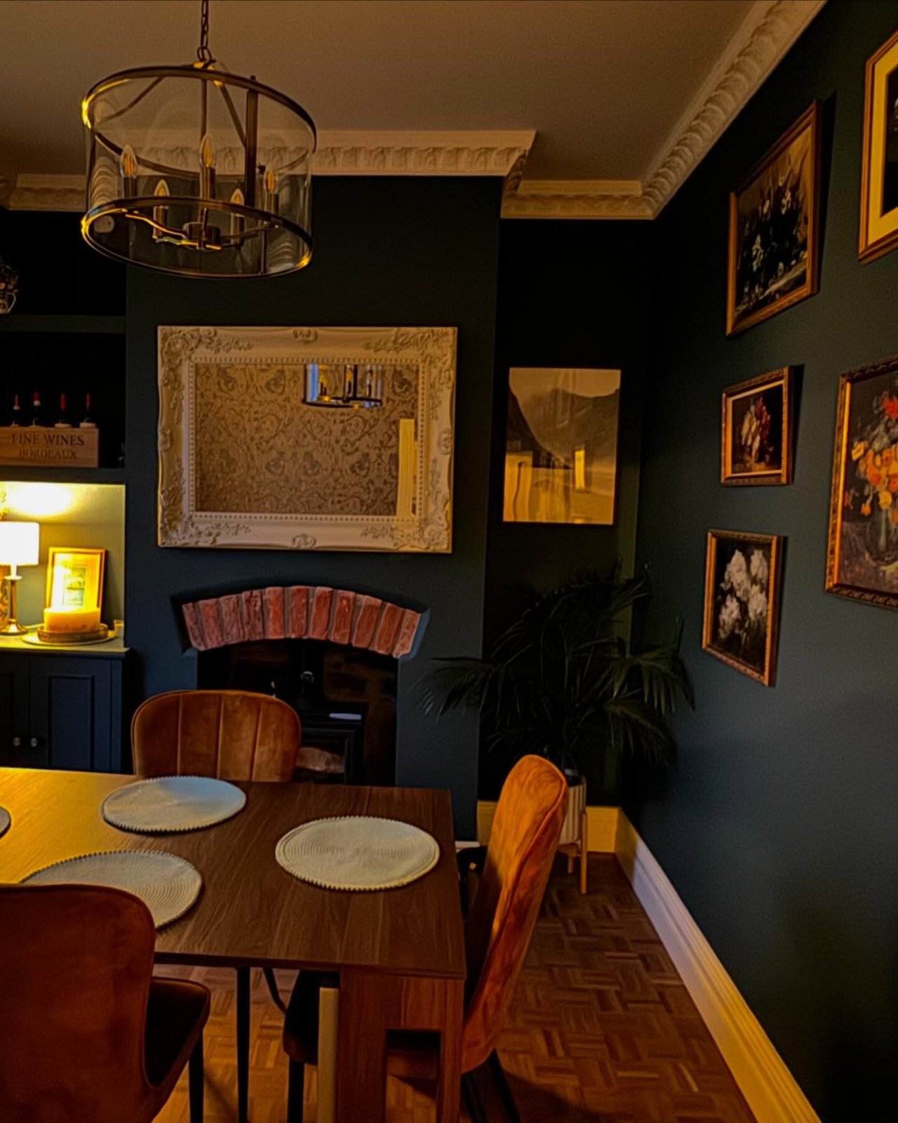 The finished dining room, with gallery wall and restored marble fireplace