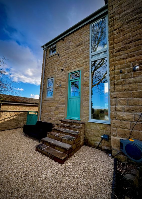 Close-up of the new extension's door and steps
