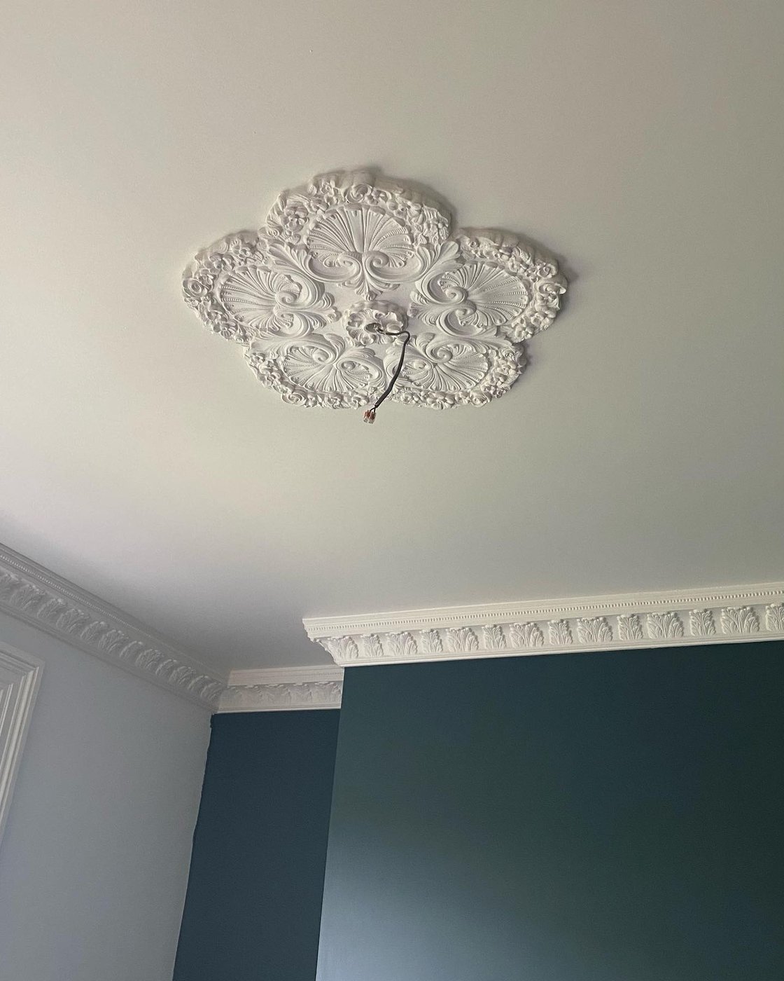 A William Morris-style rose ceiling rose in the dining room