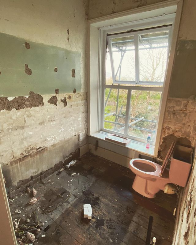 The bathroom stripped back