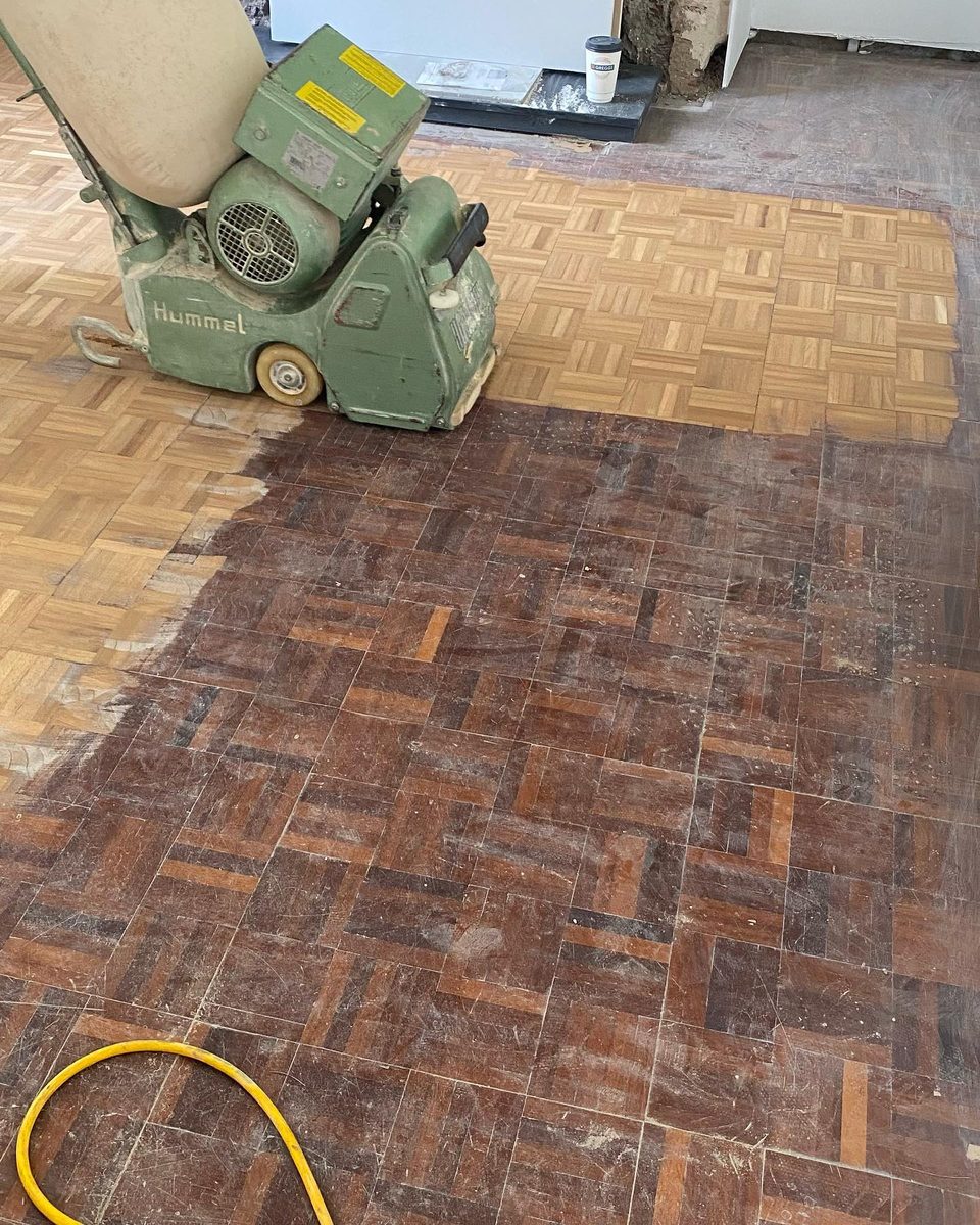 The original parquet floor being sanded back (1/4)