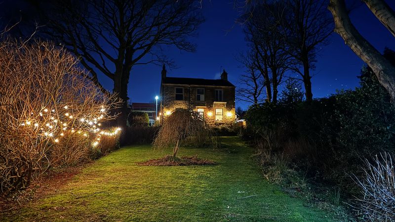 The house at night with Christmas lights
