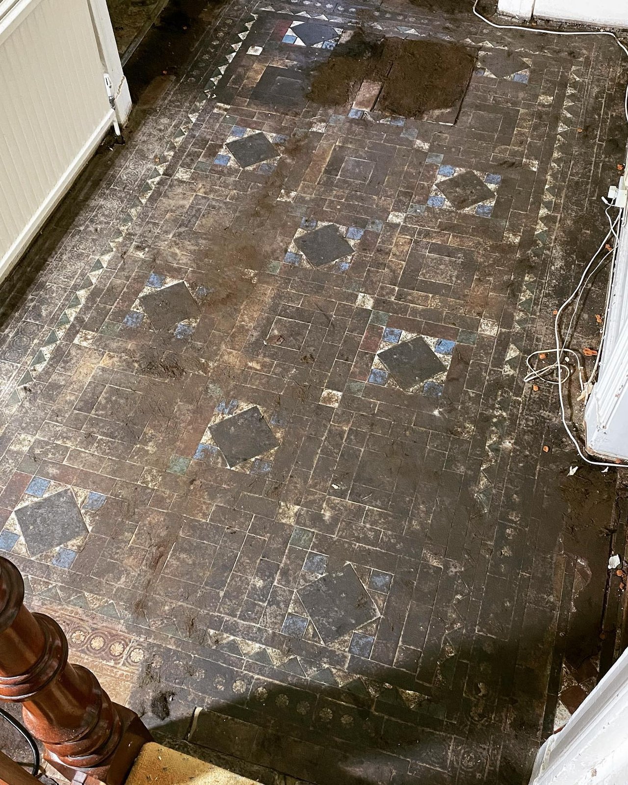 The original encaustic tiles run all the way down the hall